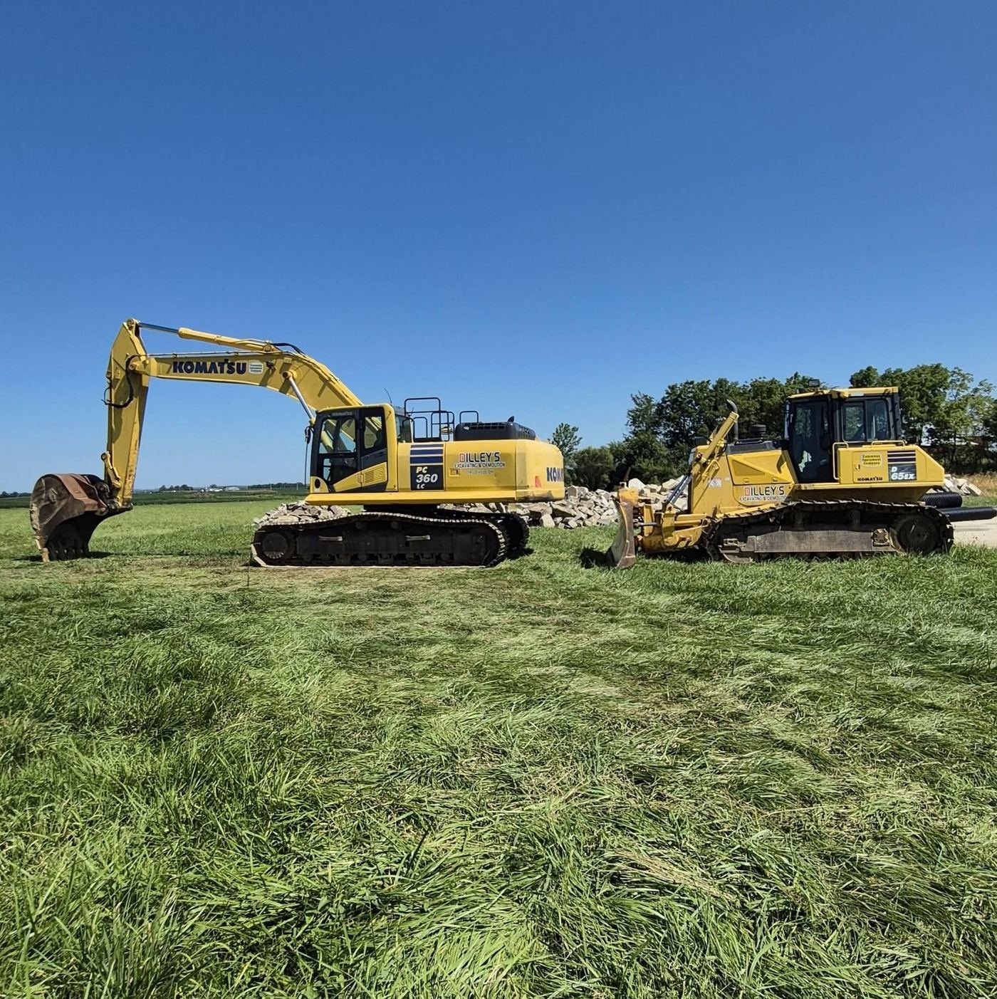 Komatsu PC360LC excavator and D65EX dozer with Dilley's lettering